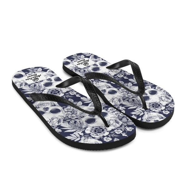 A pair of Aloha Tribe Hawaii flip flops which are also called slippers with a cool Hawaii themed graphic print.