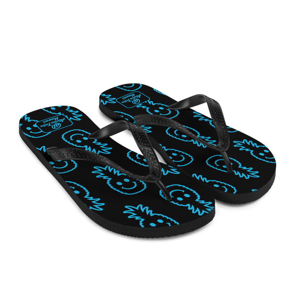 A pair of Aloha Tribe Hawaii flip flops which are also called slippers with a cool Hawaii themed graphic print.