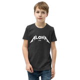 Preteen model wearing a Aloha Tribe Hawaii T-shirt that has a Hawaii themed graphic logo on the front.