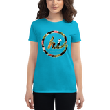 Young female wearing a Aloha Tribe Hawaii shirt that has a Hawaii themed graphic logo on the front.