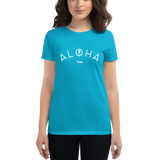 Young female wearing a Aloha Tribe Hawaii shirt that has a Hawaii themed graphic logo on the front.