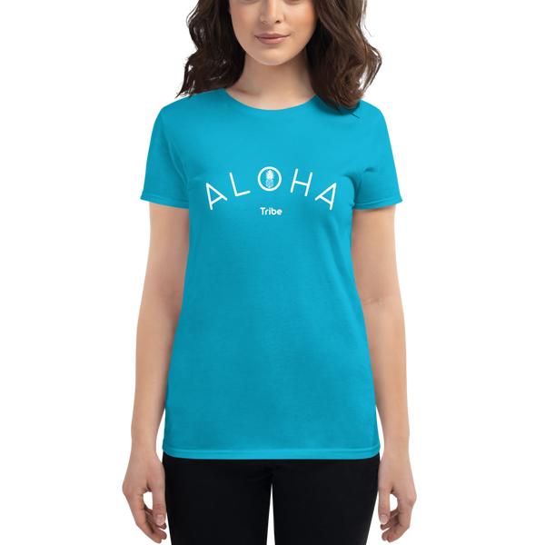 Young female wearing a Aloha Tribe Hawaii shirt that has a Hawaii themed graphic logo on the front.