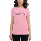 Young female wearing a Aloha Tribe Hawaii shirt that has a Hawaii themed graphic logo on the front.