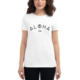 Young female wearing a Aloha Tribe Hawaii shirt that has a Hawaii themed graphic logo on the front.