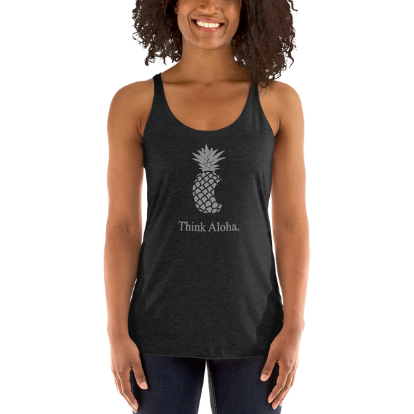 Young female wearing a Aloha Tribe Hawaii racerback tank top that has Hawaii themed graphic logos on the front.