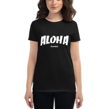 Young female wearing a Aloha Tribe Hawaii shirt that has a Hawaii themed graphic logo on the front.