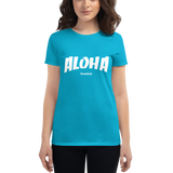 Young female wearing a Aloha Tribe Hawaii shirt that has a Hawaii themed graphic logo on the front.