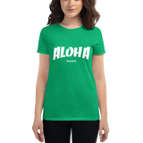 Young female wearing a Aloha Tribe Hawaii shirt that has a Hawaii themed graphic logo on the front.