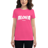 Young female wearing a Aloha Tribe Hawaii shirt that has a Hawaii themed graphic logo on the front.