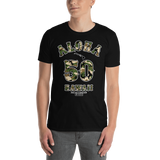 Young male adult wearing a Alter Ego Hawaii T-shirt that has a Hawaii themed graphic logo on the front.