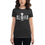 Young female wearing a Alter Ego Hawaii shirt that has a Hawaii themed graphic logo on the front.
