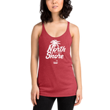 Young female adult wearing a Alter Ego Hawaii racerback tank top that has a Hawaii themed graphic logo on the front.