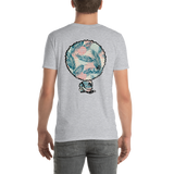 Young male adult wearing a Alter Ego Hawaii T-shirt that has a Hawaii themed graphic logo on the front.