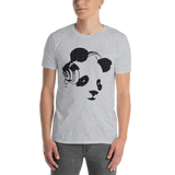 Young male wearing a Rhythm Arts Hawaii T-shirt that has a urban street themed graphic logo on the front.