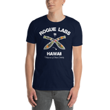 Young male wearing a Rogue Labs Hawaii T-shirt that has a urban street themed graphic logo on the front.